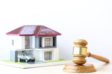 Property auction, Gavel wooden and model house on wtite background, lawyer of home real estate and ownership property concept
