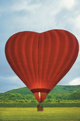 Heart-shaped Hot air Balloon Taking off