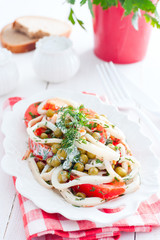 Squid Salad with Tomatoes and Green Peas, selective focus