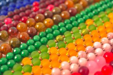 Mixed colors beads close-up made from natural stones or glass marbles