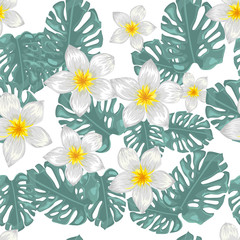 Seamless pattern with tropical flowers and palm leaves