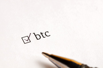 Checked checkbox with word bitcoin at wait background. questionnaire concept.