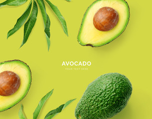 Creative layout made of avocado. Flat lay. Food concept. Macro concept. Green background.