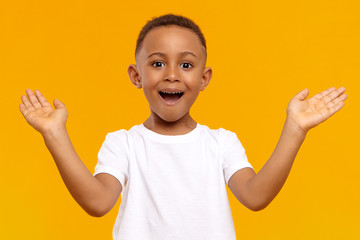 I’m so happy. Picture of overjoyed excited black little boy of African origin exclaiming...