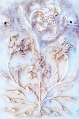 Plaster background decorative white floral pattern close