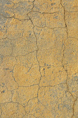 The texture of the old cement wall with scratches, cracks, dust, crevices, roughness, stucco. Can be used as a poster or background for design.