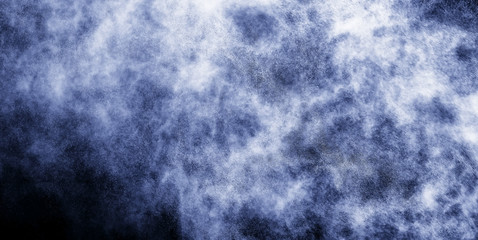 A stream of water and a cloud of drops