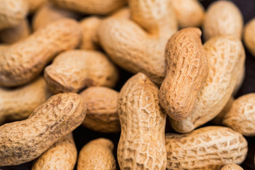 Close up unpeeled peanuts for background image