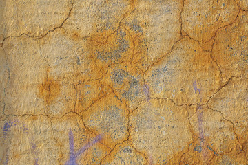 The texture of the old cement wall with scratches, cracks, dust, crevices, roughness, stucco. Can be used as a poster or background for design.