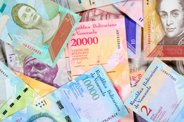 Venezuela bolivar banknotes, different bills of fuerte and soberano series. Venezuelan bolivar bills. beautiful colorful bolivares close up background. - obrazy, fototapety, plakaty