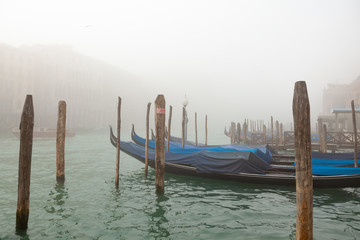 Gondolas on foggy Grand Canal