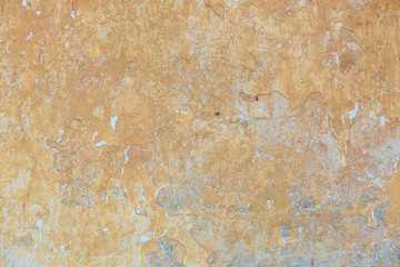 Obraz na płótnie Canvas The texture of the old cement wall with scratches, cracks, dust, crevices, roughness, stucco. Can be used as a poster or background for design.