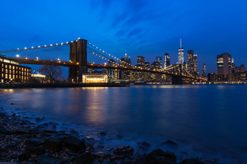 Obraz na płótnie Canvas Brooklyn Bridge in Manhattan downtown with Cityscape at night New York USA