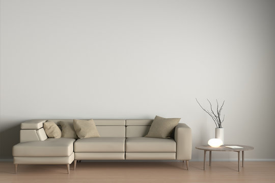 Interior Of Living Room With Beige Leather Sofa, White Lamp And Branches In Vase On Wooden Coffee Table