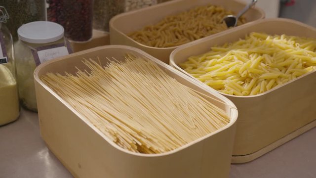 organic loose products in plastic free containers, pulling in from right to left