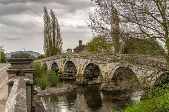 The old bridge and Atcham Bridge over the River Severn in Atcham, near Shrewsbury, Shropshire, England, UK