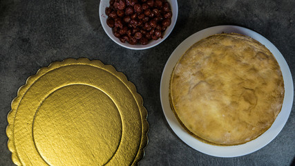 Ingredients for homemade cherry pie, cooking, on a stone table