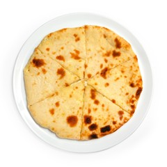 Flapjack round on a plate, top view, on a white background