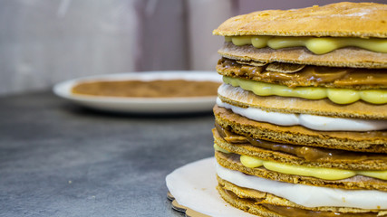 Cake with different types of delicious cream, half cake