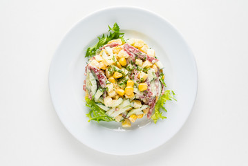 salad with corn on the white plate