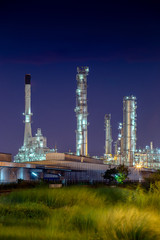 night after sunset time with agriculture field and chemical plant petrochemical and petroleum plant with reactor and distillation for chemical process in industrial area