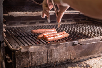 food, delicious and meat concept - roasting horse meat sausages grilled.