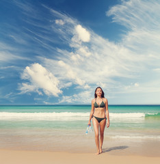 Young attractive woman relax on the sea beach