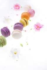 diffrent colorfull macarons on black background .pink, yellow, purple, green color macaroons 
