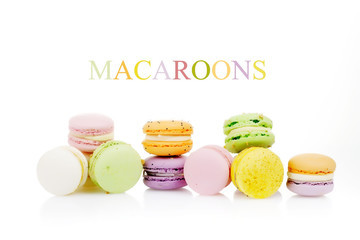 diffrent colorfull macarons on white background .pink, yellow, purple, green color macaroons 