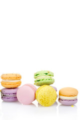diffrent colorfull macarons on white background .pink, yellow, purple, green color macaroons 