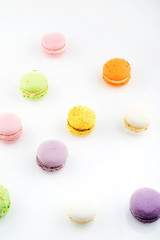 diffrent colorfull macarons on white background .pink, yellow, purple, green color macaroons 