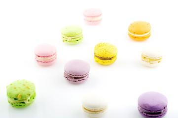 diffrent colorfull macarons on white background .pink, yellow, purple, green color macaroons 