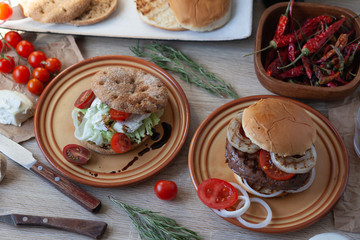 Two burger, vegan burger and beef patty burger