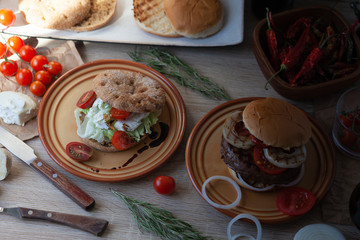 Two burger, vegan burger and beef patty burger