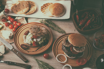 Two burger, vegan burger and beef patty burger