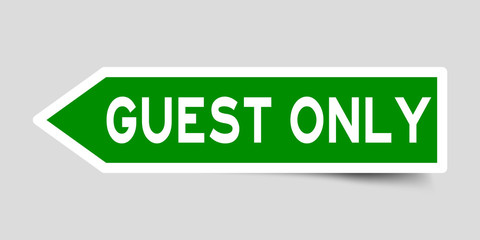 Arrow shape green color sticker in word guest only on gray background