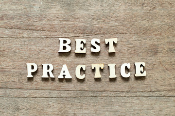 Fototapeta premium Letter block in word best practice on wood background