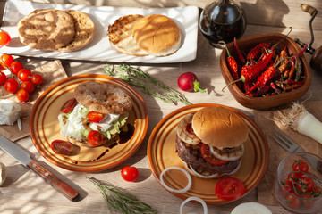 Two burger, vegan burger and beef patty burger