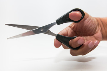 Scissors haircut in hand on white background