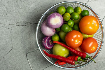 vegetables tomatoes, onions, limes, red peppers on bright background