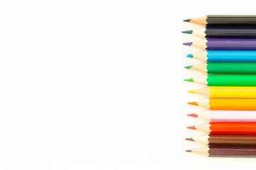 colored pencils on a white background / empty space for text