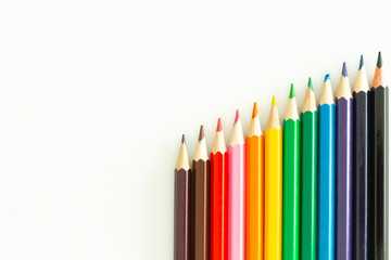 colored pencils on a white background