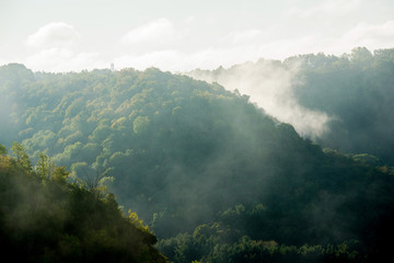 Fog rising from hills