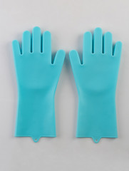 Blue rubber gloves for cleaning isolated on white