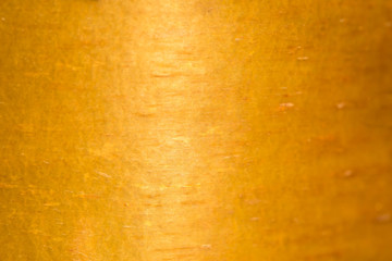 Texture of gold color with a light patch of light