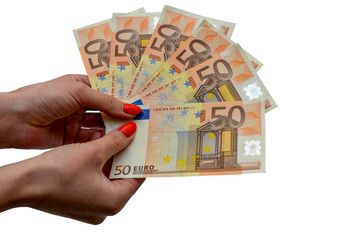 Photo on a white background - female hands hold 50 euro bills. Financial concept.