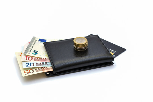 Photo on a white background - a purse with euro money and a bank card. Financial concept.