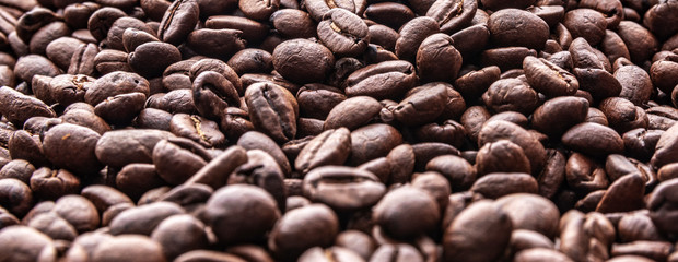 Roasted coffee beans background. Concept view of coffee beans.