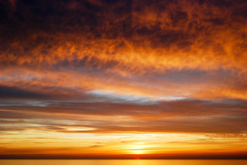 a beautiful and colorful sunset over the sea