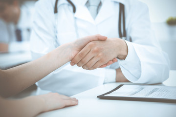 Fototapeta na wymiar Partnership, trust og doctor and patient, medical ethics concept. Handshake in medicine